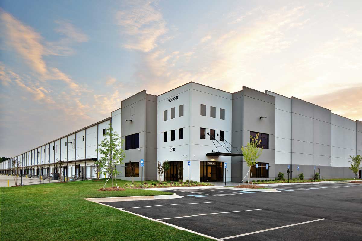 A photo of the exterior of a large commercial facility.